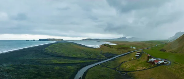 Iceland black sand beach with huge waves at Reynisfjara Vik. Aerial cinematic 4k video. Beautiful Iceland nature coastline from above.