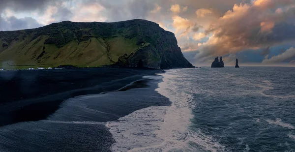 Iceland black sand beach with huge waves at Reynisfjara Vik. Aerial cinematic 4k video. Beautiful Iceland nature coastline from above.