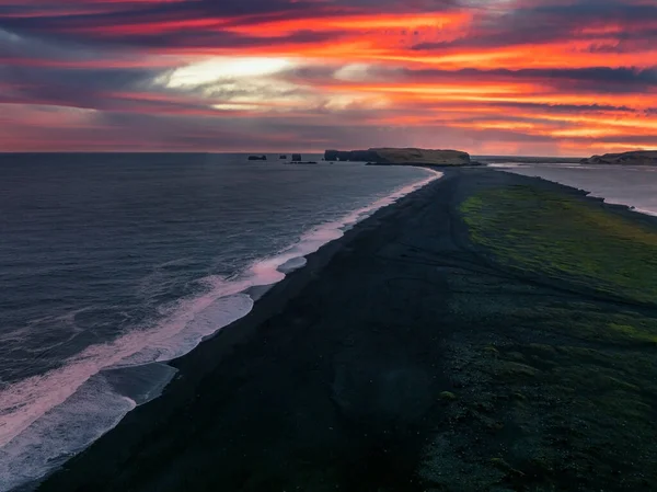 Iceland black sand beach with huge waves at Reynisfjara Vik. Aerial cinematic 4k video. Beautiful Iceland nature coastline from above.