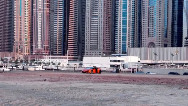 Orange Lamborghini Sports Car Parked Sand Famous Marina Bay District — ストック動画