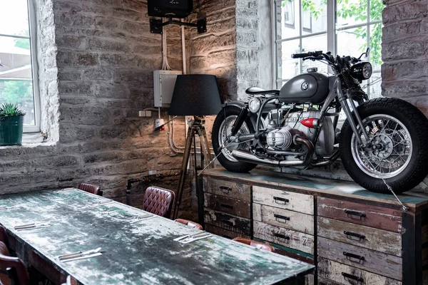 Motorcycle Weathered Table Drawers Lamp Window Motorbike Arranged Brick Wall — Stockfoto