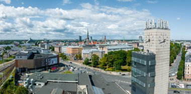 Riga, Latvia. July 10, 2022. Aerial view of the Riga central train station tower with name of the city and clock. Riga title on top of the tower.