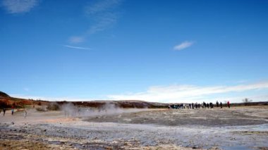 Steam emitting from Strokkur geyser in Iceland. Beautiful geyser eruption on a sunny day. Scenic view of famous attraction in Iceland.