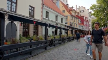 Beautiful summer day in Riga. People and tourists exploring old town of Riga, Latvia.