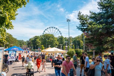 Palanga, Lithuania. August 10, 2022. The main street with crowds of people walking down the Palanga, enjoying beautiful summer time.