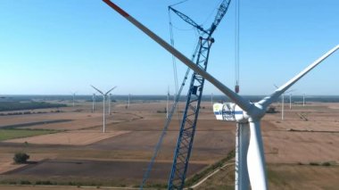 A close up view of the assembling turbine. Wind Turbine Construction. Aerial view.