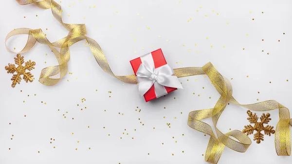 Celebratory White Background Gift Box Gold Ribbon Stars Gold Snowflake — Stock Photo, Image