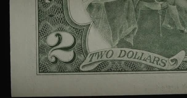 Two US dollars cash macro view. 2 cash. Under a magnifying glass. — Stock video