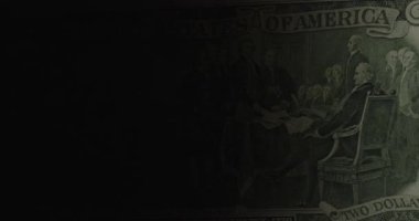 2 dolarlık banknot. 2 dolarlık banknotun sürgülü çekimi. Siyaha 2 dolar..