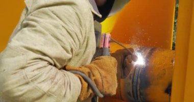 The Gasman Welds The Pipes At The Factory With A Welding Machine. High quality 4k footage