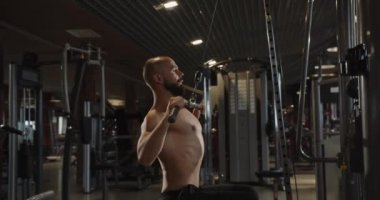 A man lifts a mass with a Hammer Curl. Physical and muscle training with weights for bodybuilding training.