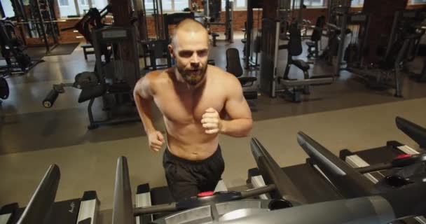 Handsome Young Athletic Man Running Treadmill Working Out Gym Alone — Stockvideo