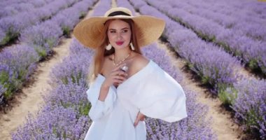 seductive sexy girl applies perfume on her body and enjoys the smell