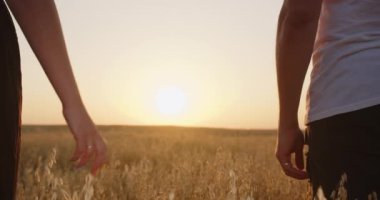 the boy and the girl held hands. close