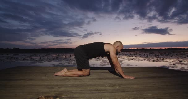 Man Does Yoga River Bank Sunset Summer — Stock Video