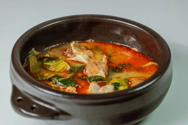 Ugeojigalbitang, Korean Cabbage and Short Rib Soup : Napa cabbage leaves slowly simmered in a beef rib stock and seasoned with doenjang (soybean paste). Ugeoji refers to the green outer layer of Napa cabbage or other leafy vegetables.
