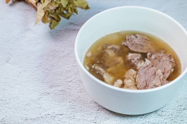 Galbitang, Korean style beef Short Rib Soup : Beef ribs, soaked in cold water to remove the blood, and white radish chunks simmered together until tender. The clear stock is rich and savory, and the tender meat falls off the bone. (Glass noodles may 