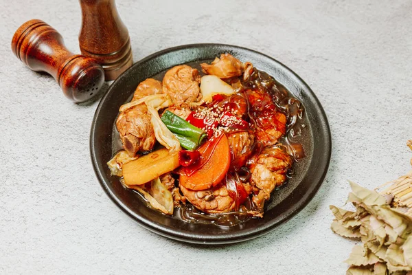 Andongjjimdak, Korean Braised Chicken : To make this dish, chicken is cut into pieces and braised with carrot, potato, and other vegetables, along with a soy sauce-based seasoning.