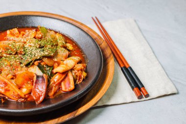 Korean food Stir-fried Squid, ojingeobokkeum : Squid stir-fried with onions, carrots, and cabbage in a spicy mixture of gochujang and red chili powder.