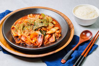 Korean food Stir-fried Squid, ojingeobokkeum : Squid stir-fried with onions, carrots, and cabbage in a spicy mixture of gochujang and red chili powder.