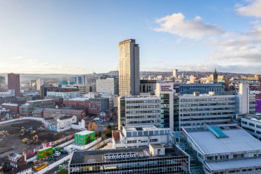 SHEFFIELD, UK - DECEMBER 16, 2021. Aerial view of Sheffield city skyline with The Arts Tower and Hallam University buildings at sunset