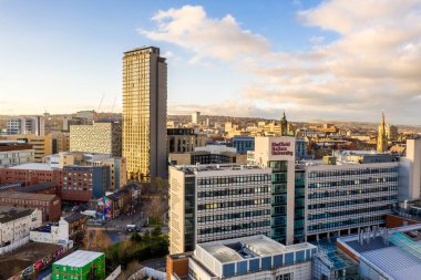 SHEFFIELD, UK - DECEMBER 16, 2021. Aerial view of Sheffield city skyline with The Arts Tower and Hallam University buildings at sunset