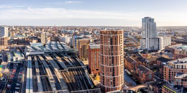 An aerial cityscape view of Leeds railway station providing transport links to the West Yorkshire conurbation