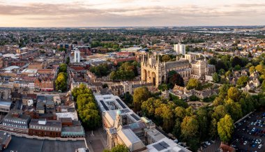 PETERBOROUGH, UK - AUGUST 4, 2022.  An aerial cityscape of Peterborough Cathedral and town centre at sunset