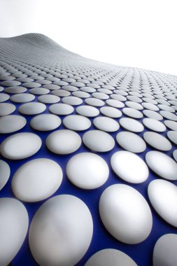 Close up the exterior facade of the Selfridges building in Birmingham Bullring with futuristic discs in a modern architecture image