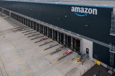 LEEDS, UK - AUGUST 19, 2022. Aerial view of a the empty loading bays at a large Amazon Prime distribution warehouse at Gateway 45 near the M1 motorway in Leeds, UK