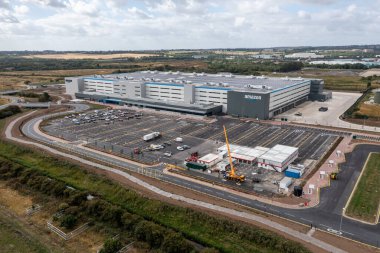 LEEDS, UK - AUGUST 19, 2022. Aerial view of a large Amazon Prime distribution warehouse at Gateway 45 near the M1 motorway in Leeds, UK