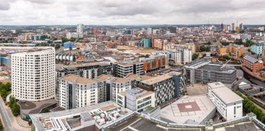 LEEDS, UK - AUGUST 19, 2022.  An aerial panorama cityscape of Leeds Dock area of the city centre with luxury waterfront properties at Roberts Wharf