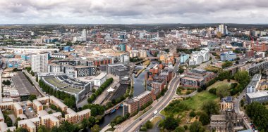 LEEDS, UK - AUGUST 19, 2022.  An aerial panorama cityscape of Leeds Dock area of the city centre with luxury waterfront properties at Roberts Wharf