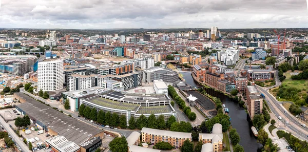 LEEDS, UK - AUGUST 19, 2022.  An aerial panorama cityscape of Leeds Dock area of the city centre with luxury waterfront properties at Roberts Wharf