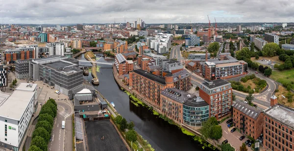LEEDS, UK - AUGUST 19, 2022. Aerial panoramic view of Leeds city dock and Roberts Wharf area with luxury waterfront apartment blocks