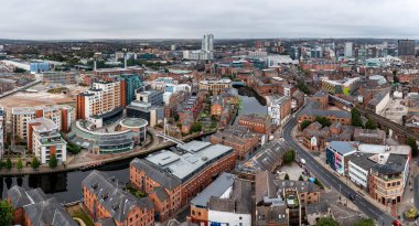 LEEDS, UK - SEPTEMBER 2, 2022.  An aerial panorma view of Leeds cityscape skyline with Leeds Dock and Robert's Whaf on the Leeds to Liverpool canal