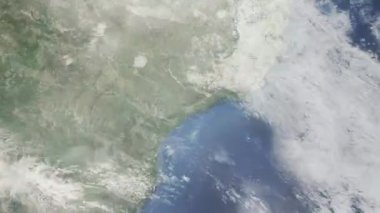 Dünyanın uzaydan şehire yakınlaşması. Üç boyutlu animasyon. Brezilya 'nın Guarullus şehrine yakınlaş. Video görüntülerini stokla. 4K