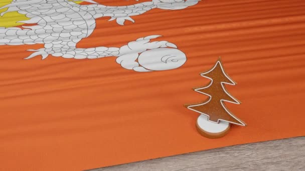 Lebkuchenhaus Mit Der Flagge Bhutans Auf Dem Tisch — Stockvideo