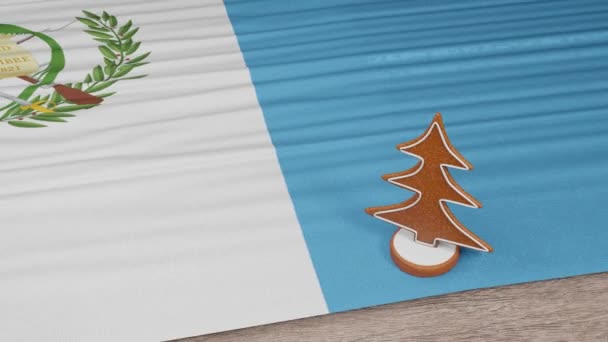 Lebkuchenhaus Mit Der Flagge Guatemalas Auf Dem Tisch — Stockvideo