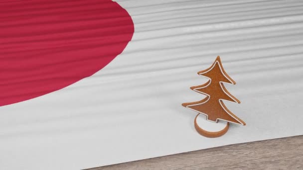 Pepparkakshus Med Japans Flagga Bordet — Stockvideo