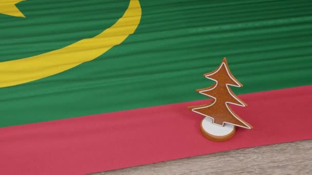 桌上挂着毛里塔尼亚国旗的姜饼屋 — 图库视频影像