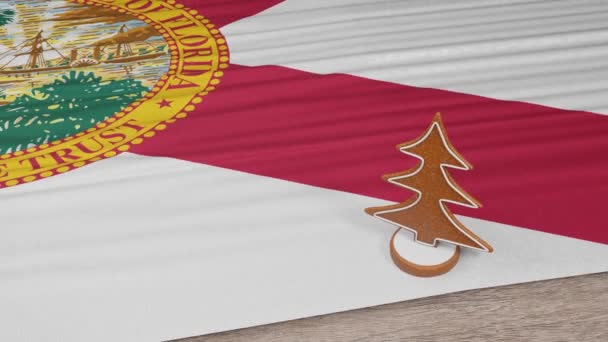 テーブルの上にフロリダの旗のあるジンジャーブレッドハウス — ストック動画
