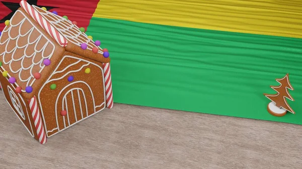 Masasında Gine-Bissau bayrağı olan zencefilli kurabiye evi.