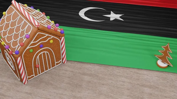 Masasında Libya bayrağı olan zencefilli kek evi.