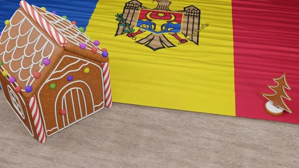 진저브레드 하우스와 몰도바 국기를 테이블에 — 스톡 사진