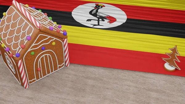 Masasında Uganda bayrağı olan zencefilli kurabiye evi.