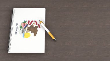 Illinois bayrağı ve yalancı bir kalemin olduğu bir defter.