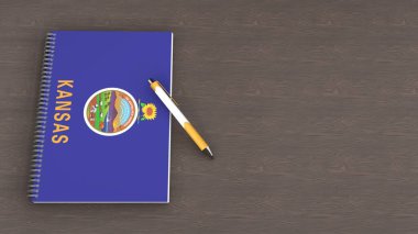 A notebook with the flag of Kansas and a lying pen clipart