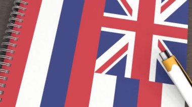 Hawaii bayrağı ve yalancı bir kalemin olduğu bir defter.