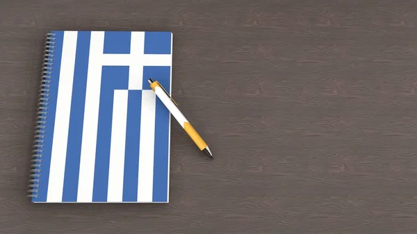 Yunanistan bayrağı ve yalan kalemi olan bir defter.